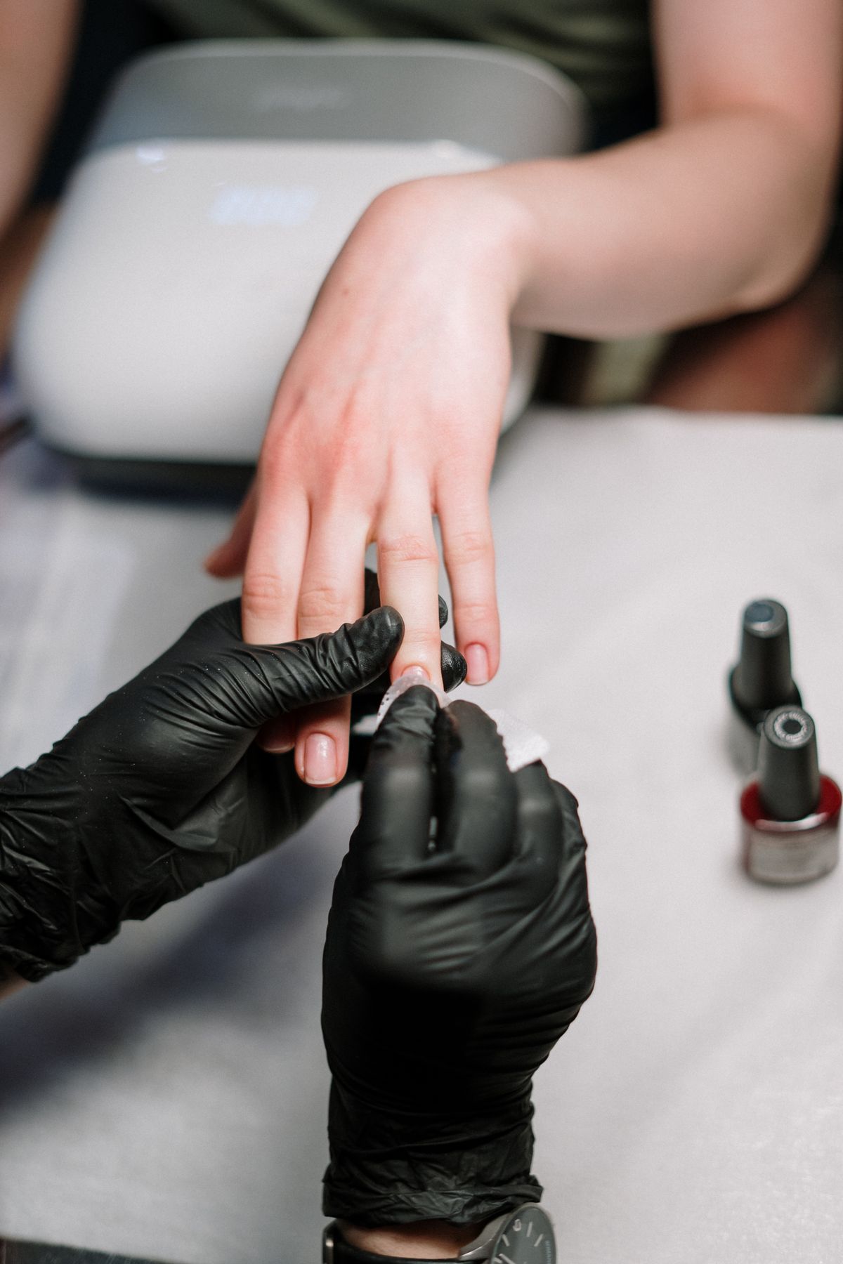 Manicure in progress at a nail studio
